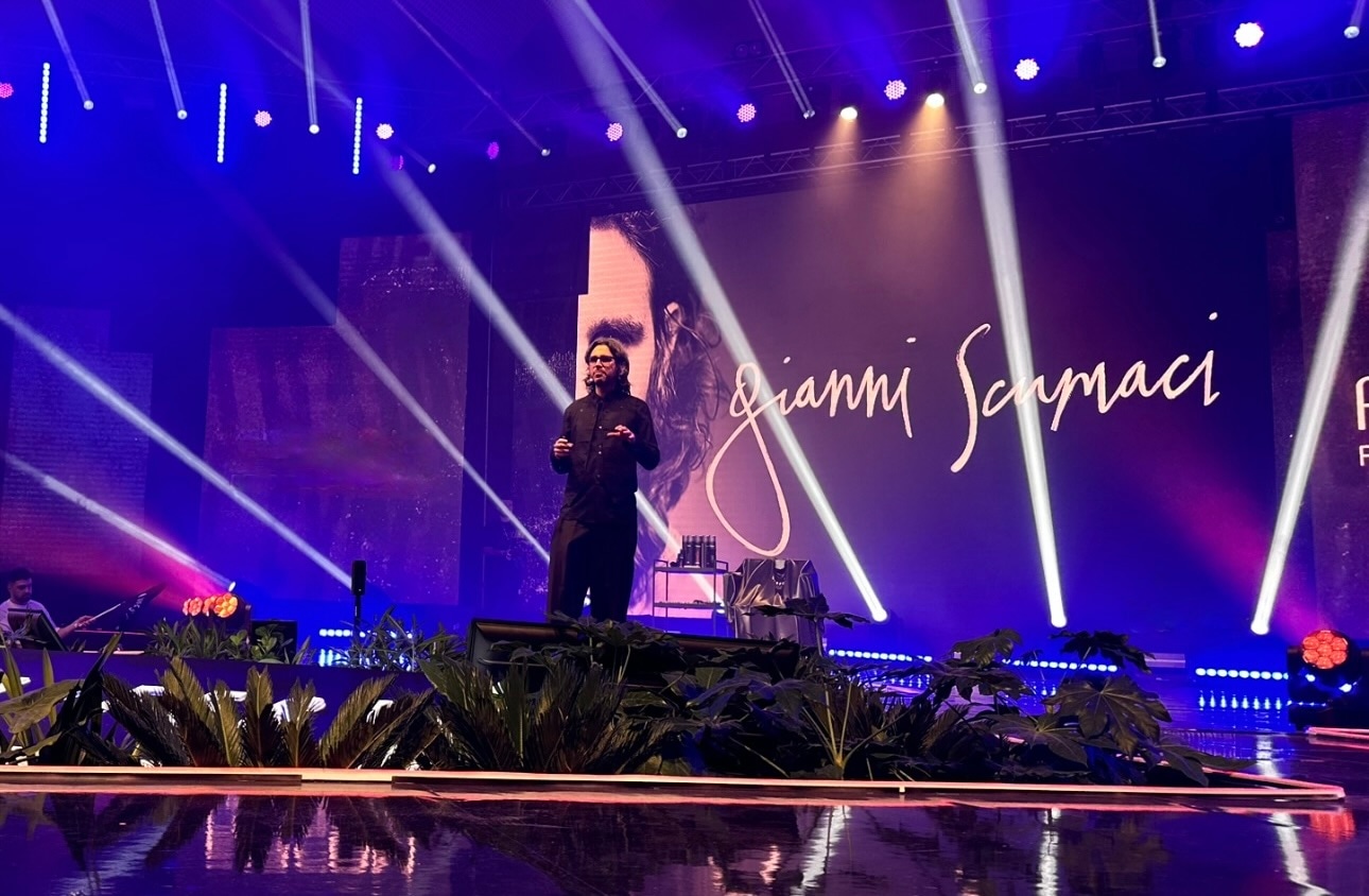 Gianni cutting hair in front of a crowd 2020's hero